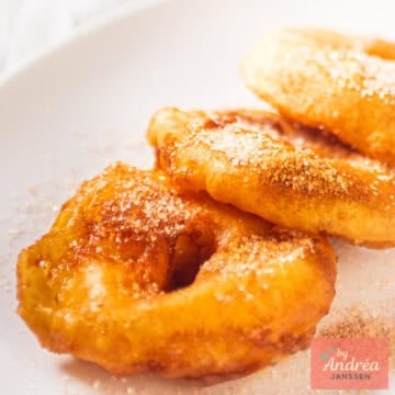 A square pircture with appel beignets (apple beignets)