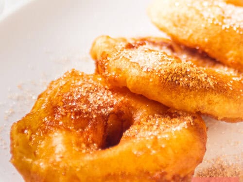 A square pircture with appel beignets (apple beignets)