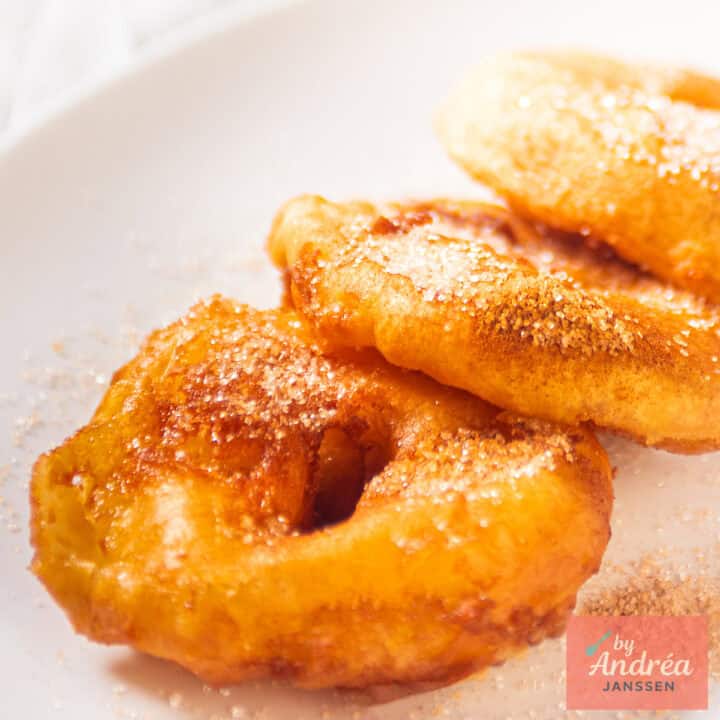 A square pircture with appel beignets (apple beignets)