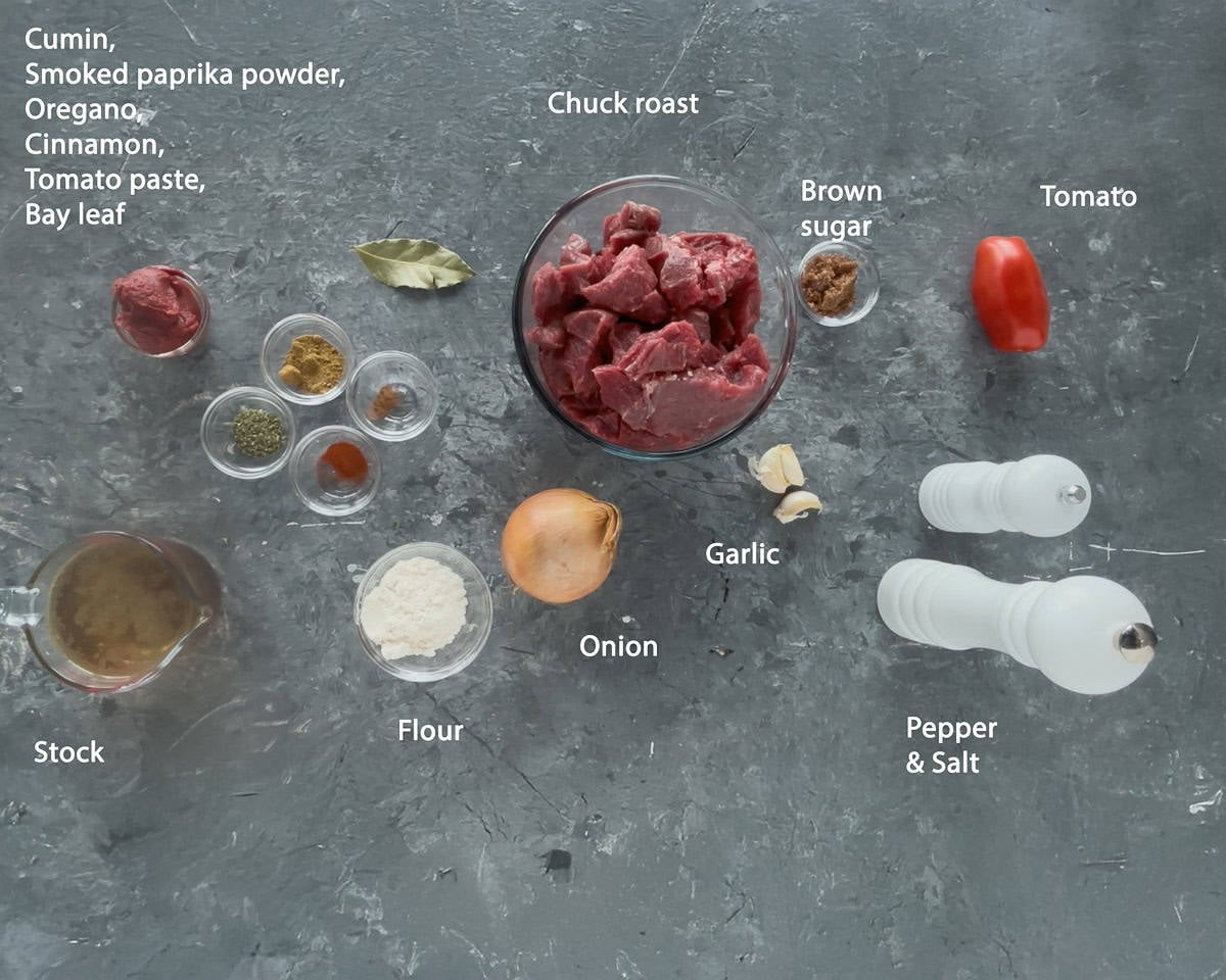 Ingredients Mexican Beef Stew on a grey background with text description