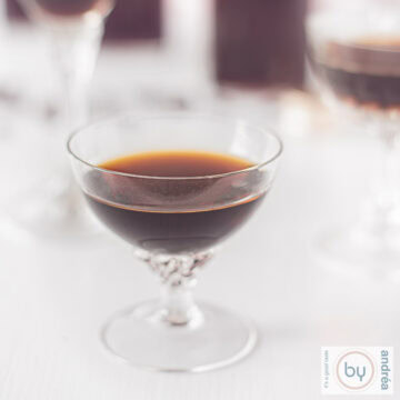 A square picture of a glass filled with Tia Maria