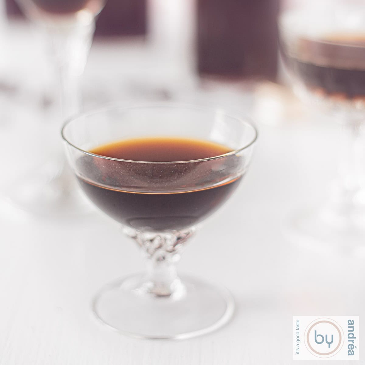 A square picture of a glass filled with Tia Maria