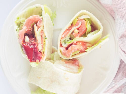 square picture with a salmon tortilla wrap up