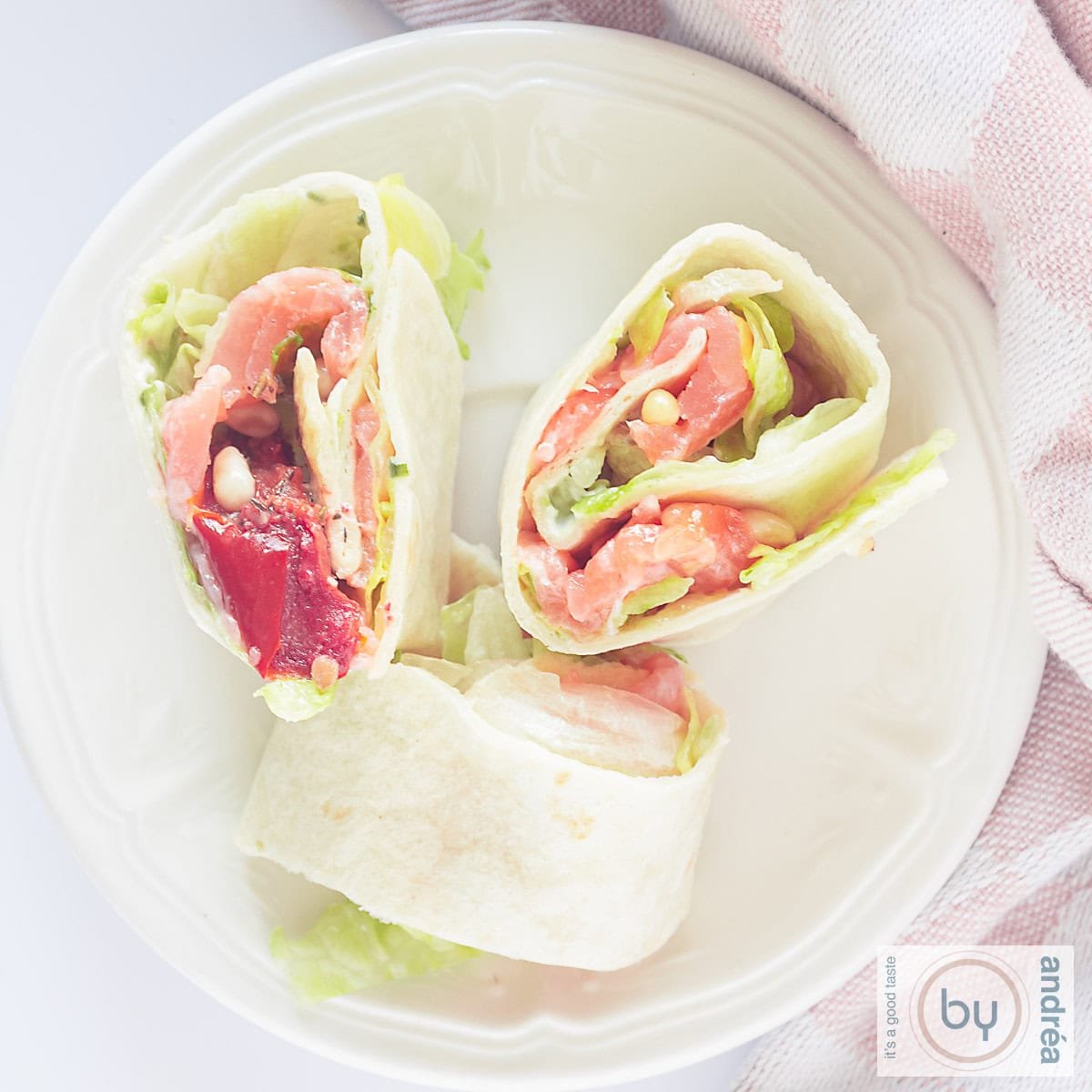 square picture with a salmon tortilla wrap up