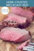 A few slices of perfectly grilled roast beef. A text at the top: Easy recipe, herb-crusted bbq roast beef