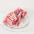 Parma ham on a glass plate on a white background