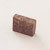 A beef stock cube on a white background