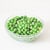 green peas in a glass bowl on a white background