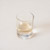 White wine vinegar in a glass on a white background