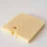 A slice of Emmental cheese on a white background