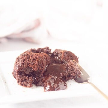 a ramekin with a chocolate pudding with a liquid heart