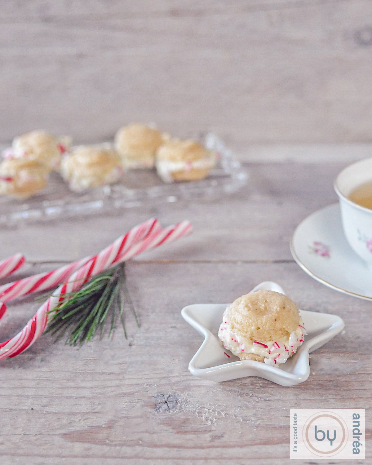 Christmas macaron a star-form plate. Some candycanes and more macarons in the back