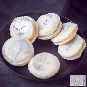 Macarons with chocolate Baileys filling on a black plate