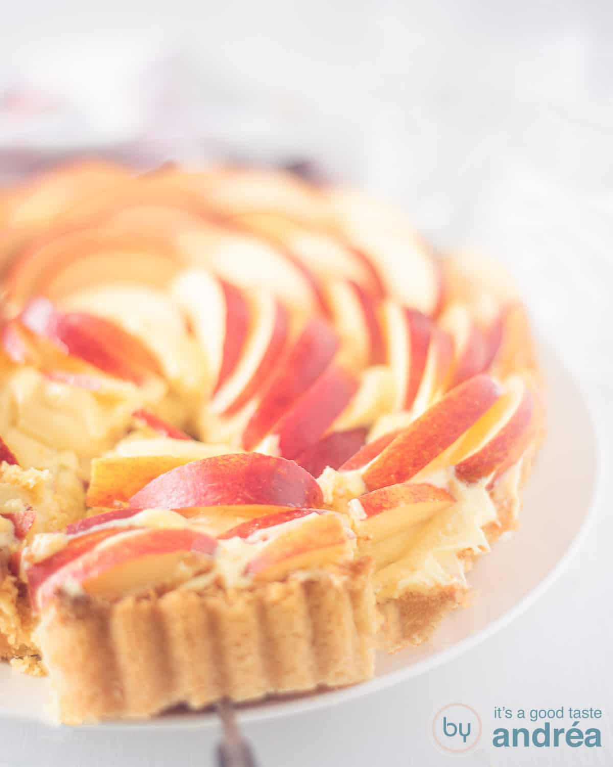 Rose apple pie on a white plate on a white background
