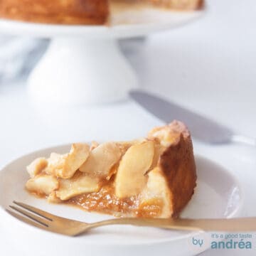 A delicious apple pie on a white plate with a tea towel. A square photo