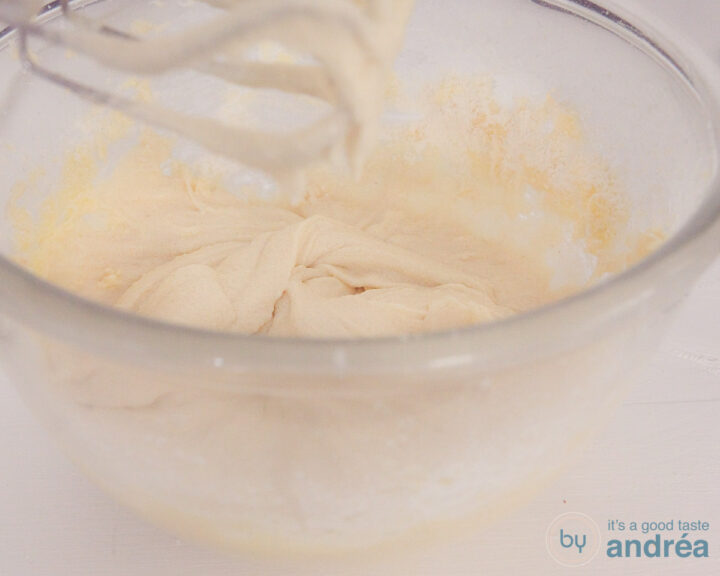 a glass bowl filled with cupcake batter.