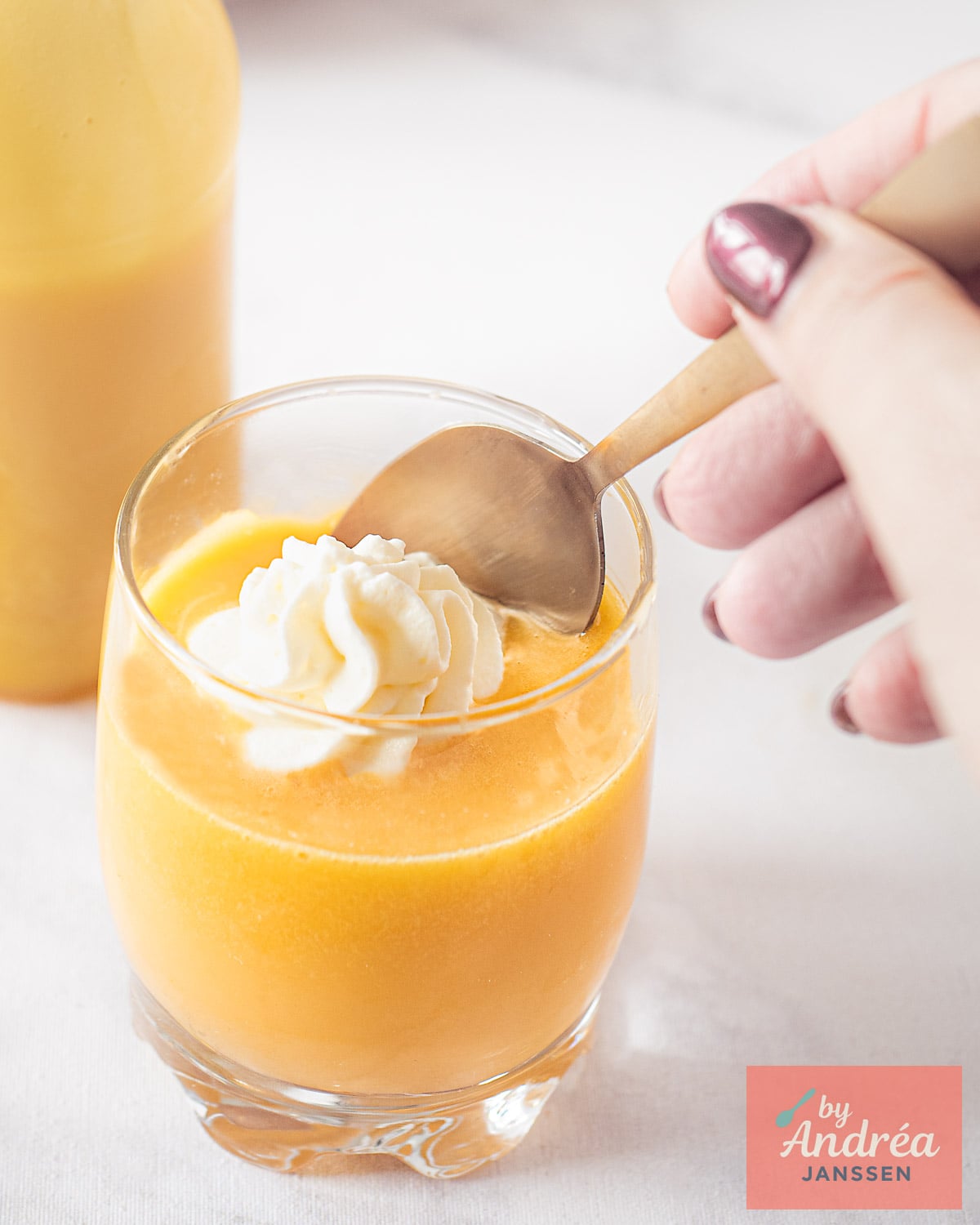 Spoonful of thick advocaat with whipped cream