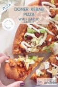 Part of a doner kebab pizza with garlic sauce and iceberg lettuce and chicken. A text overlay on top of doner kebab pizza with garlic sauce, pizza, easy recipe, full of flavor