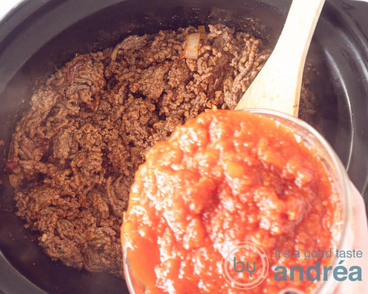 Add the diced tomatoes to the slow cooker