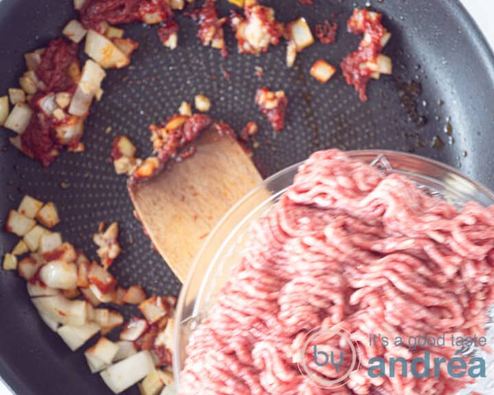 Fry the ground beef until brown.