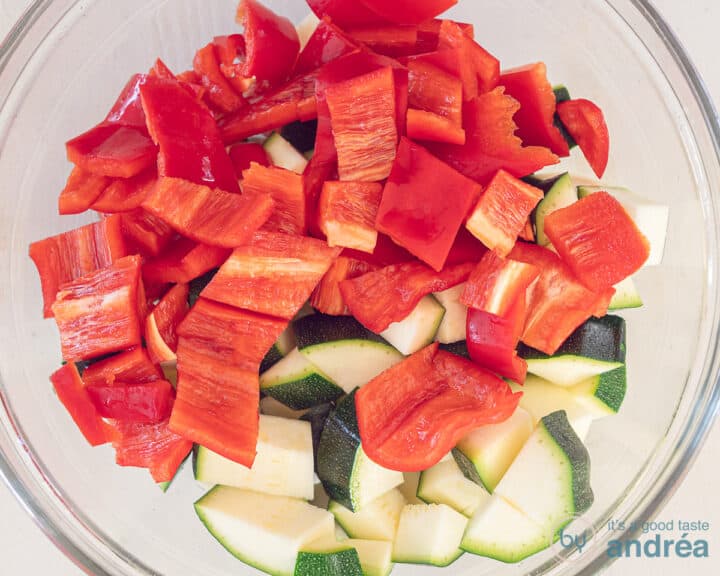 A bowl with diced sweet point pepper and zucchini