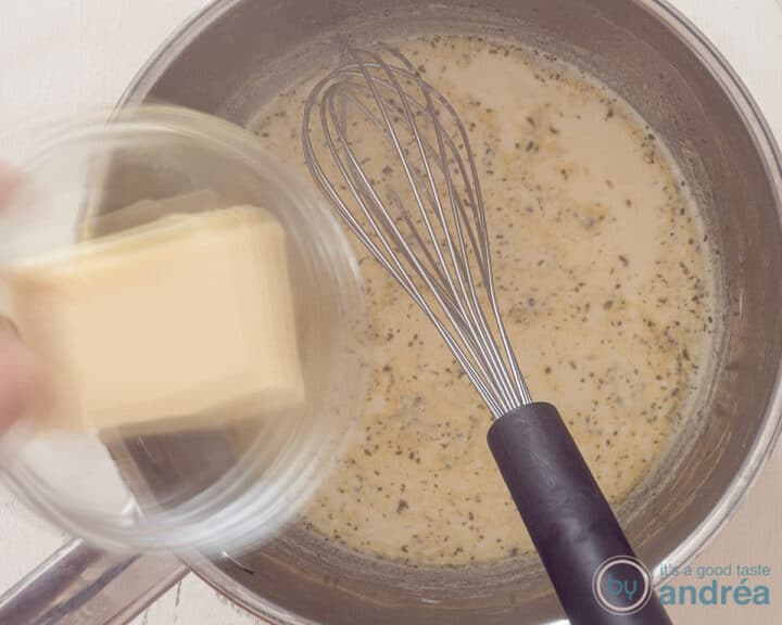 The butter is added to the warm stock milk.