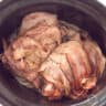 Roast beef in the slow cooker wrapped in bacon