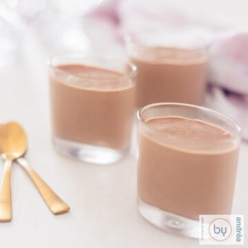 three amuse glasses filled with chocolate mousse with a tic