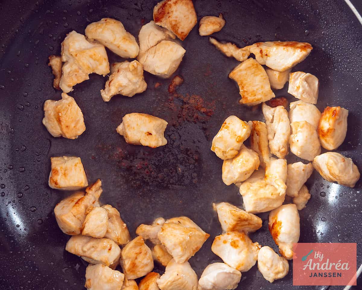Chicken cubes fried in a pan