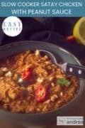 Part of a gray bowl with tender chicken and satay sauce. A text at the top: easy recipe, Slow Cooker Satay Chicken with Peanut Sauce