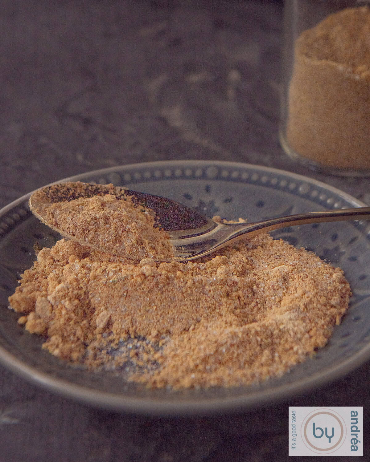 A gray saucer with homemade babi pangang spices