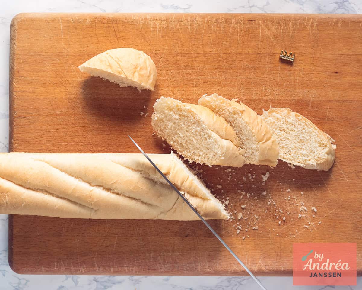 A baguette is cut into slices.