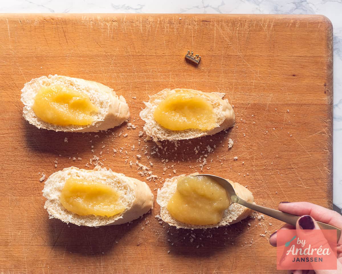 Applesauce is spread on slices of baguette