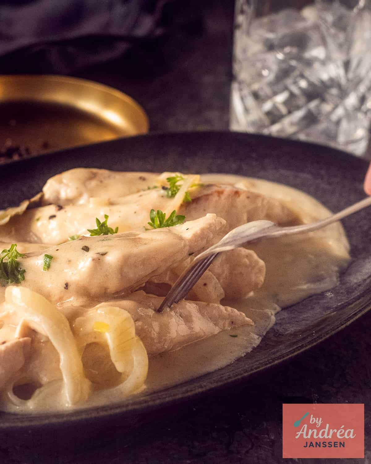 A dish with chicken fillet fricasée in a delicious cream sauce with onion and parsley