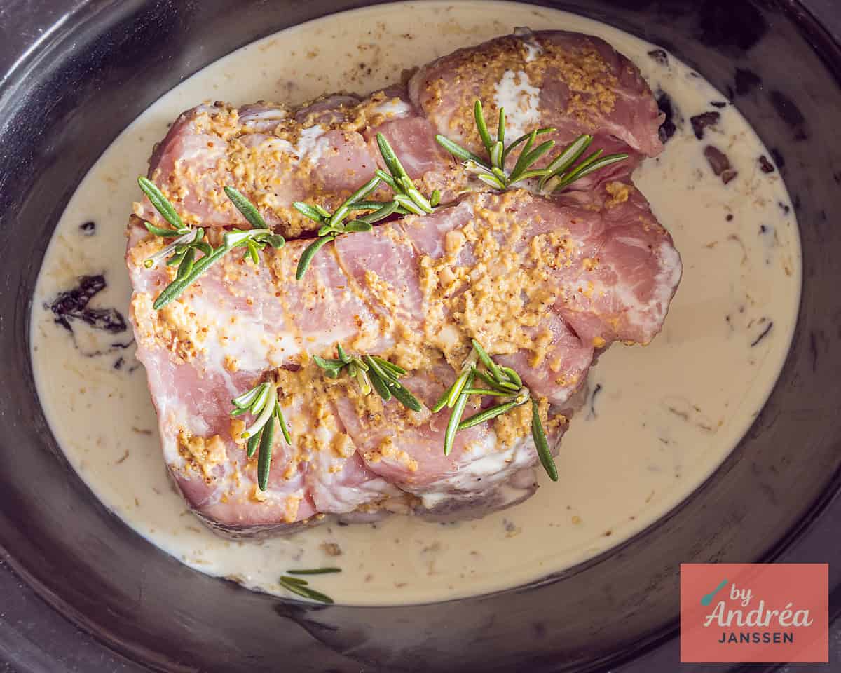 A slow cooker rolled roast filled with rosemary and mustard garlic marinade in cream