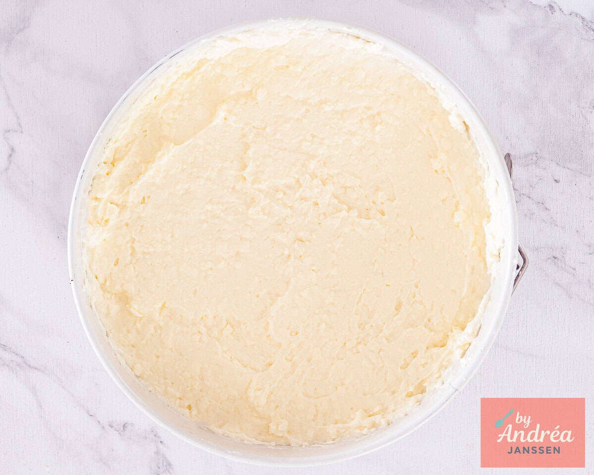 A springform pan with a layer of monchou filling