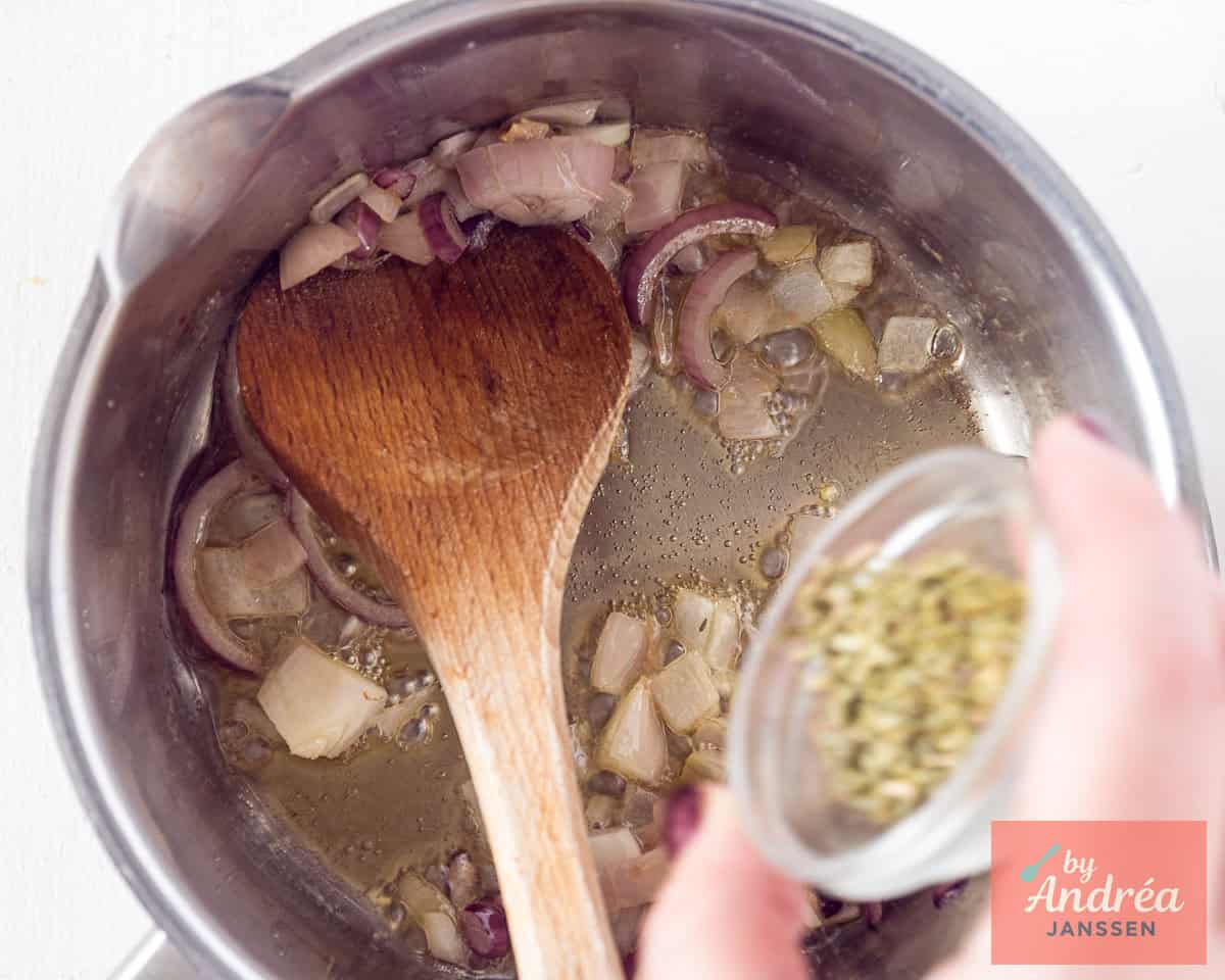 A saucepan with shallot and thyme
