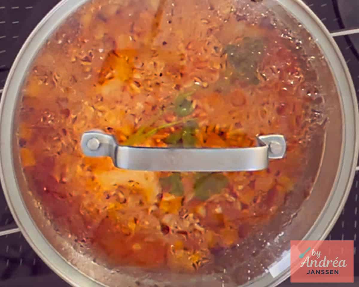 Rice is cooked with the lid on the pan.