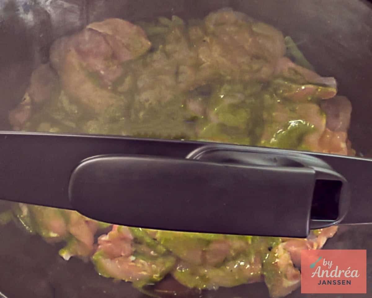 Slow cooker with lid on. Place Tuscan chicken in it.