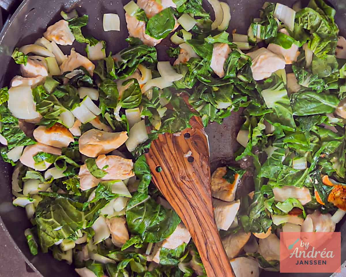 A pan with chicken and bok choy