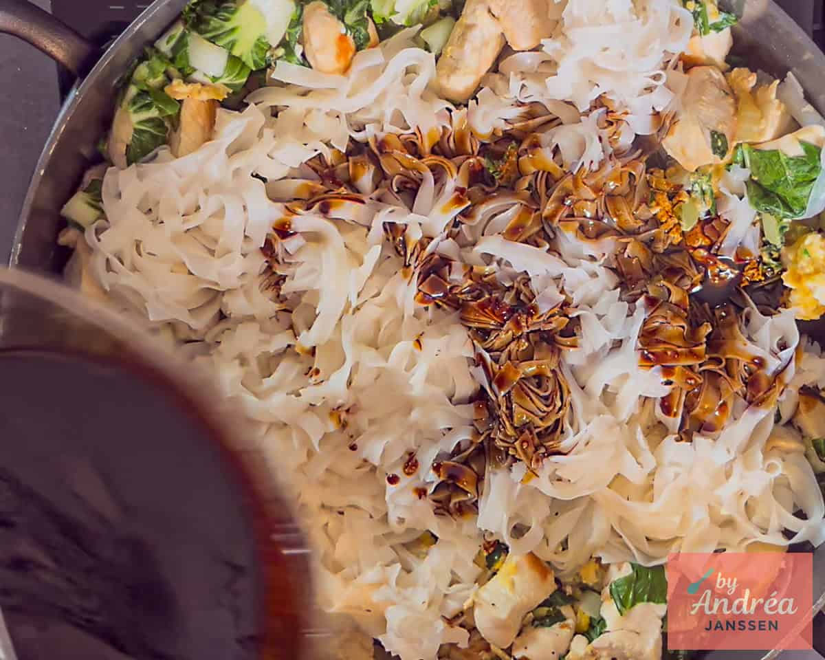 Add sauce to the pan with the rice noodles with chicken and bok choy