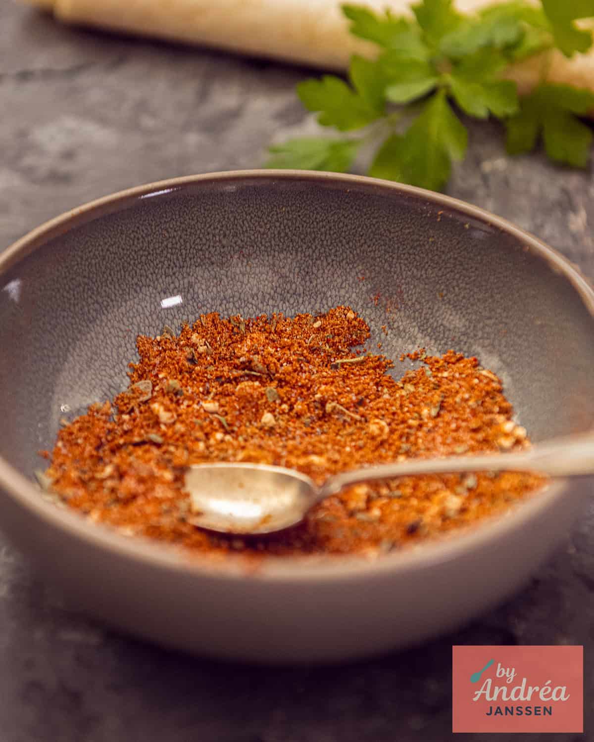 A bowl of herbs to season burrito ground beef.