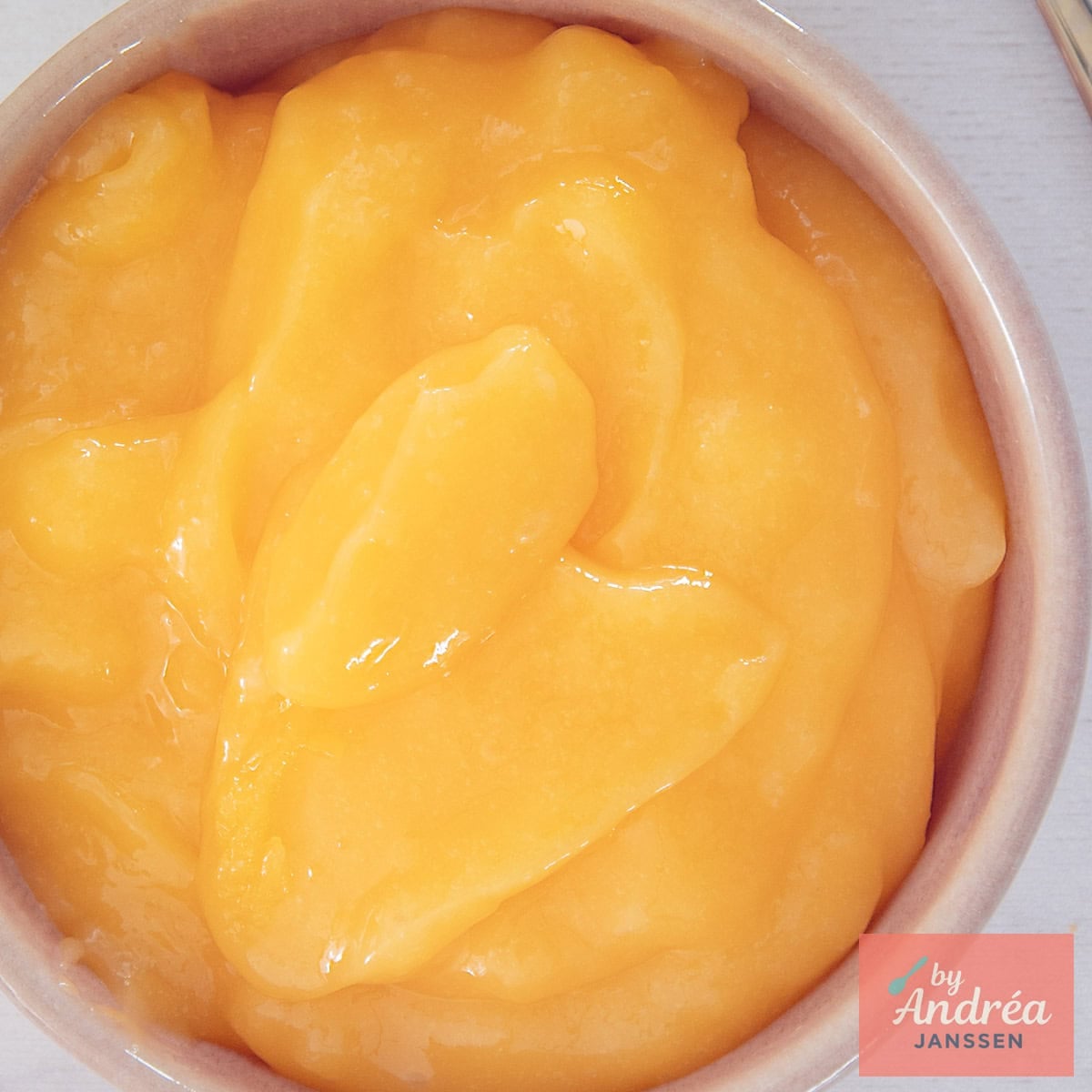 A square photo with creamy lemon curd.