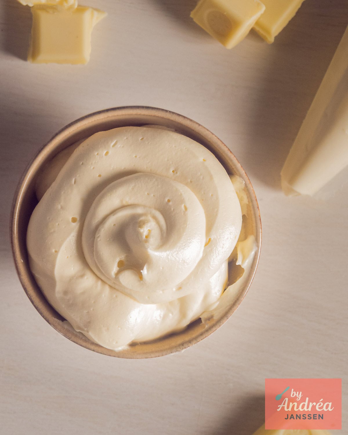 A photo from above of a bowl of Fluffy Buttercream with White Chocolate