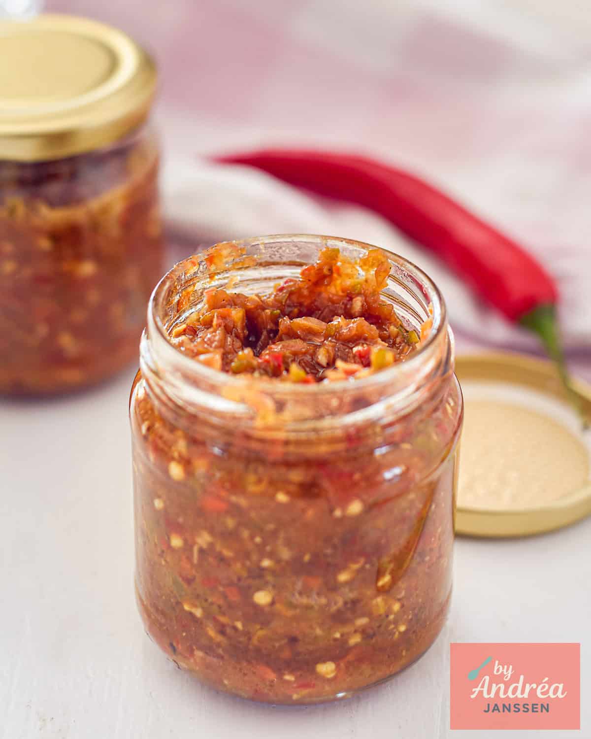 a glass jar in which you Make Homemade Sambal Badjak with Fresh Peppers