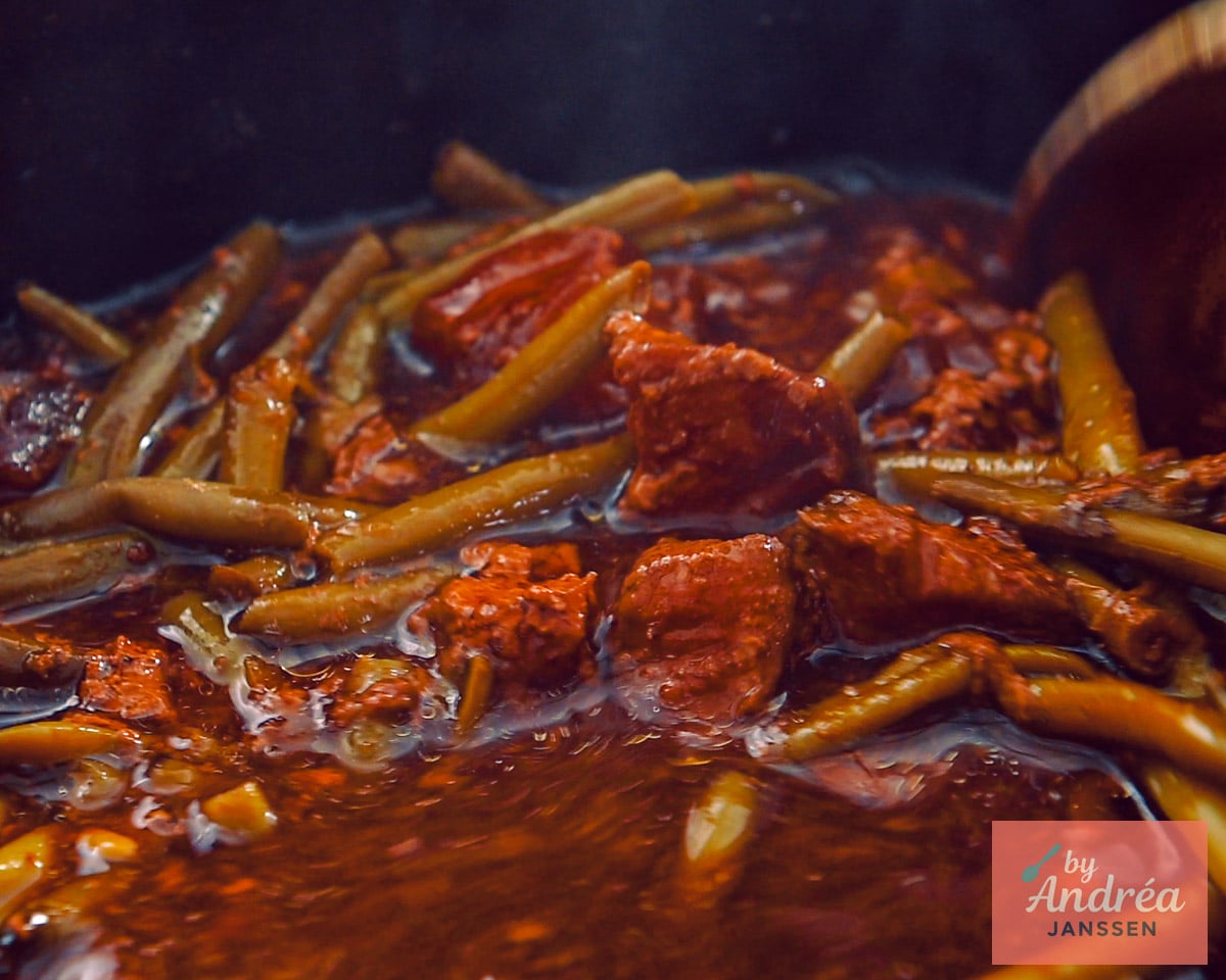 Beef and sauce mixed together in the slow cooker