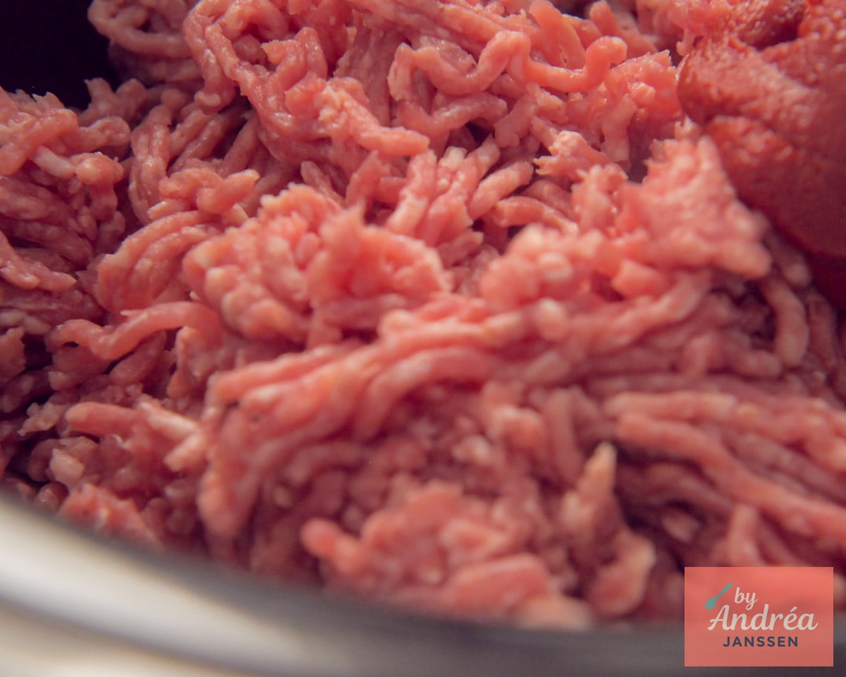 Ground beef goes into the slow cooker first, creating the hearty base for the chili con carne.
