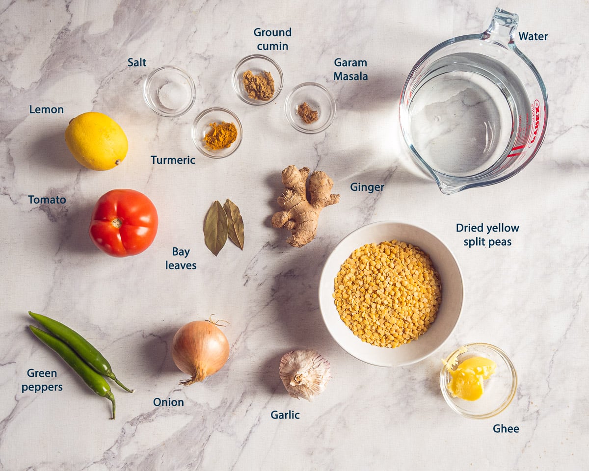 Ingredients for yellow split pea dal, including split peas, tomato, ginger, and spices, with English labels.
