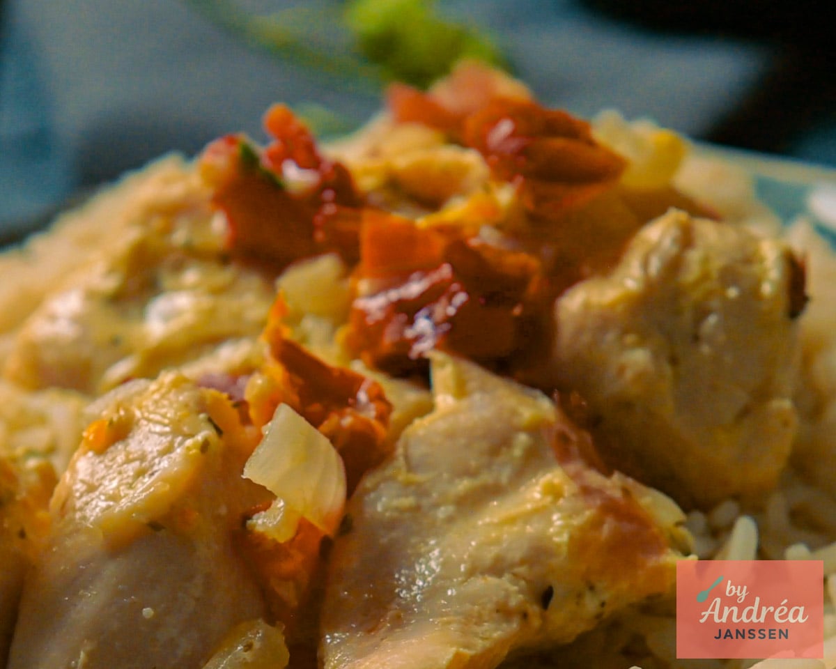 Chicken pieces in creamy Boursin sauce with sun-dried tomatoes and crispy prosciutto served over rice.